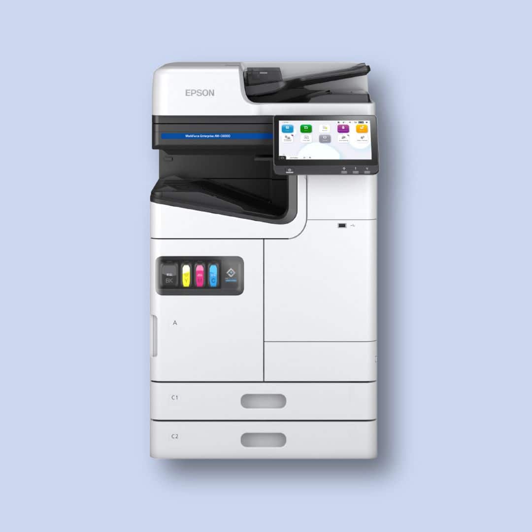 A white Epson multifunction printer with a touchscreen display, paper trays, and visible color ink cartridges, set against a light blue background.